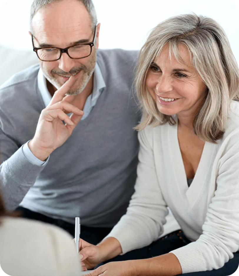 A Unity Partners adviser discussing a financial plan with a couple